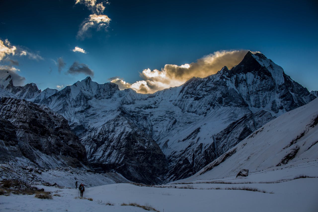 Breathtaking view of snow-capped Annapurna mountains during twilight in Nepal.